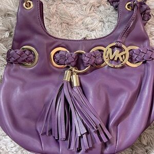 Purple Michael Kors bag with gold hardware